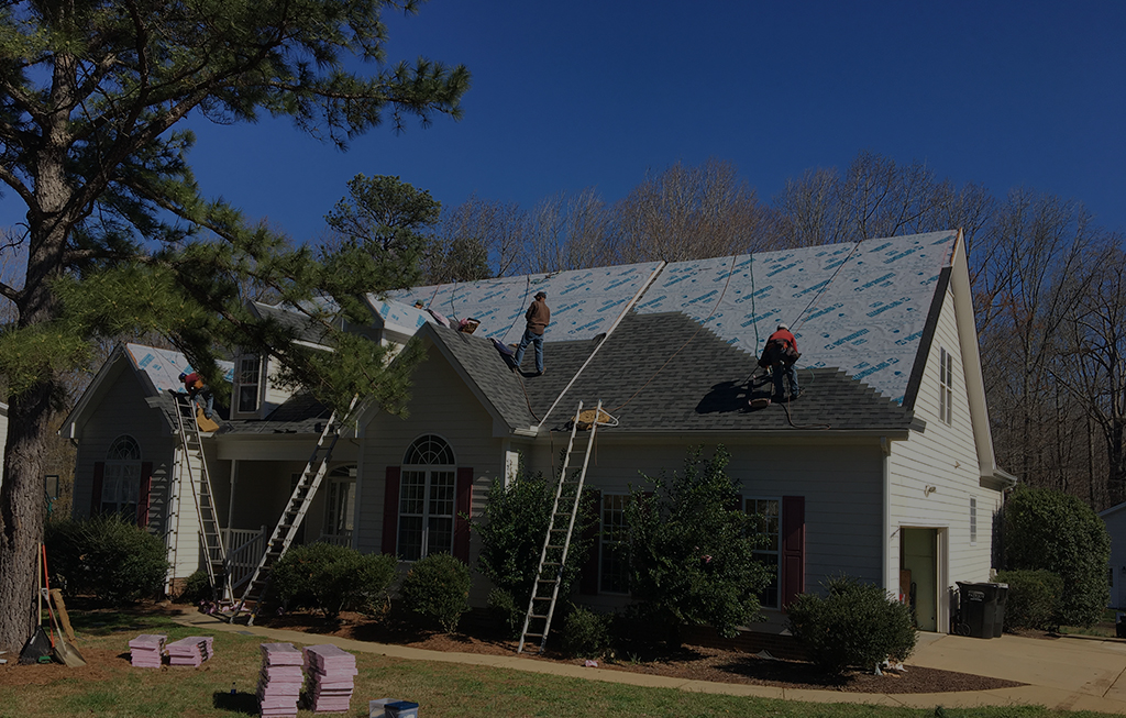 Crusader Roofing crew installing a roof